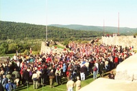 All of the scouts and adults from the campout standing around the flag pole on the fort.  There is no flag on the pole.