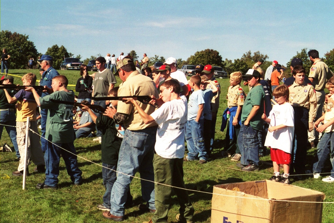 A group of scouts are shooting files.