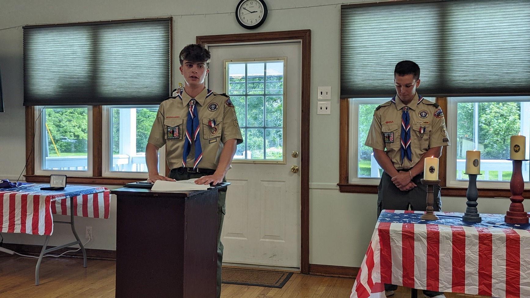 Ben giving a speech from behind a podium.