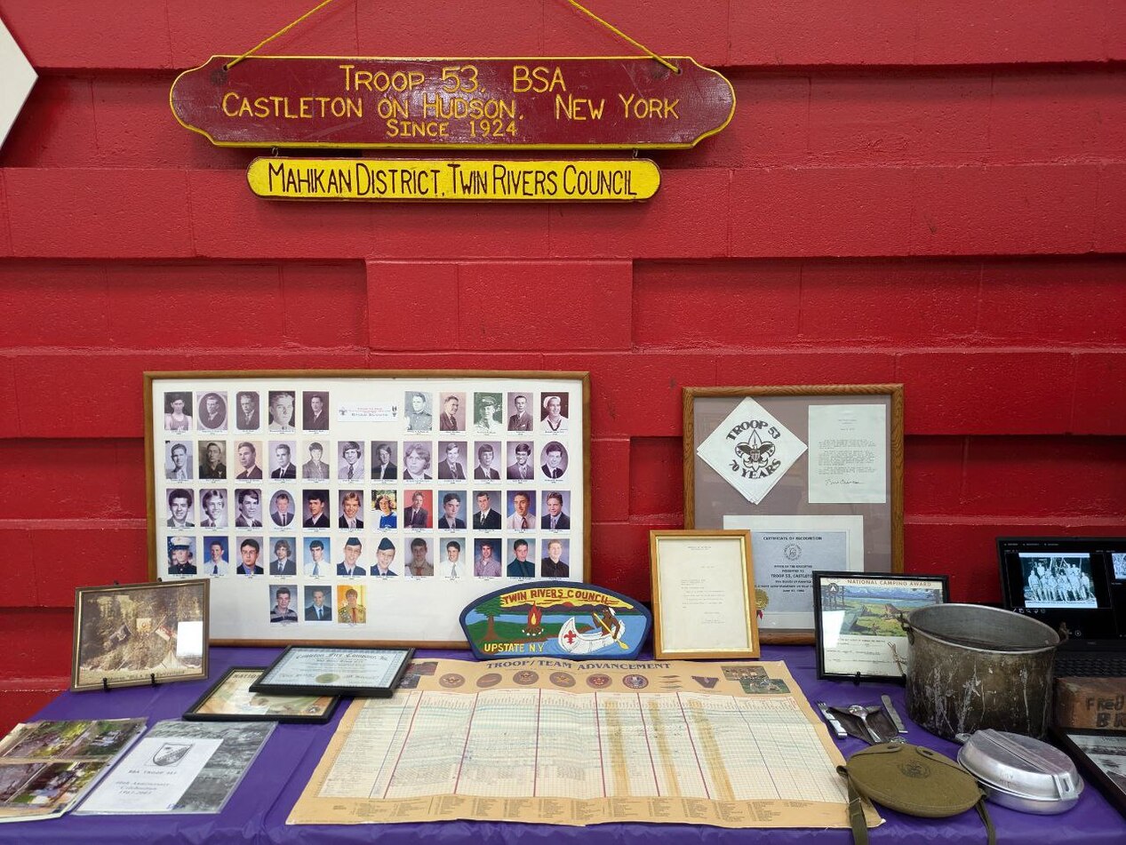 A bunch of scouting memorabilia.  To the top is a sign that says 